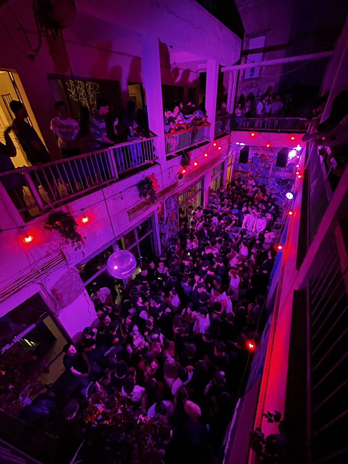 ARTHINA — courtyard packed with visitors